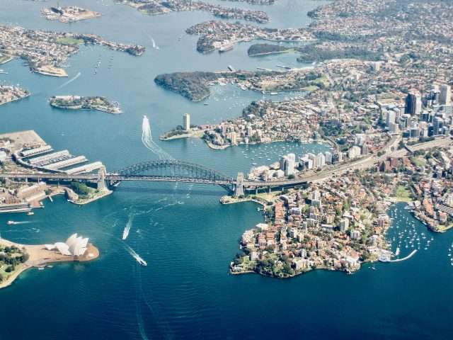 https://dazzlingdawn.com/wp-content/uploads/2023/06/View-of-Sydney-Harbour-from-the-plane-window.jpeg