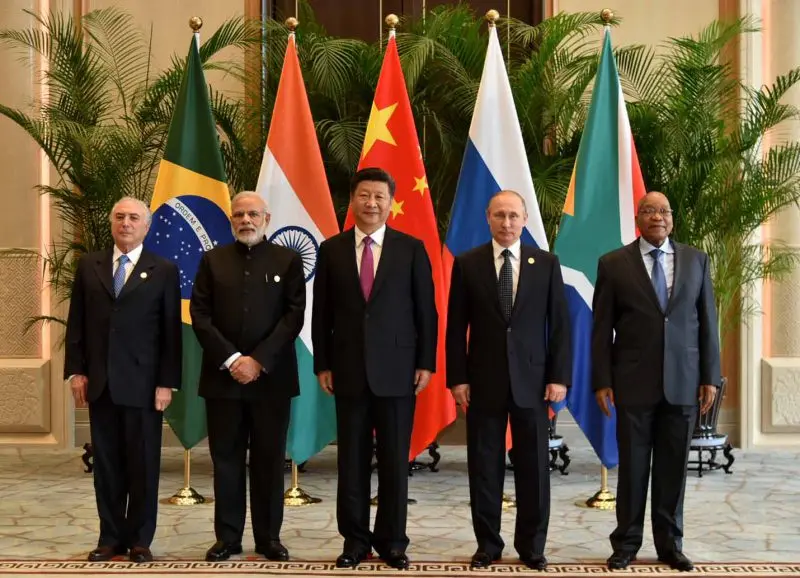 https://dazzlingdawn.com/wp-content/uploads/2023/07/BRICS-leaders-summit-flags.webp